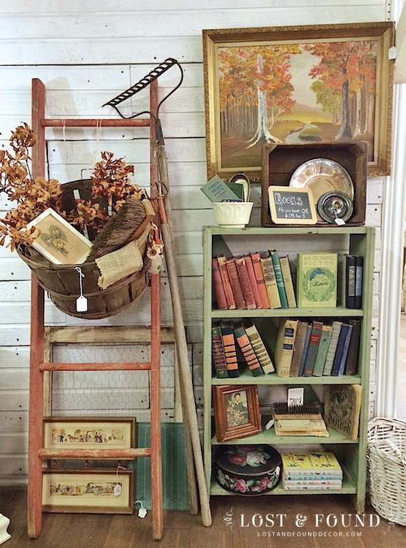 fall antique booth display with old ladder