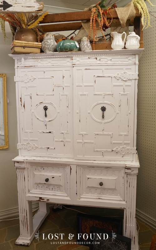 painted and distressed white cabinet