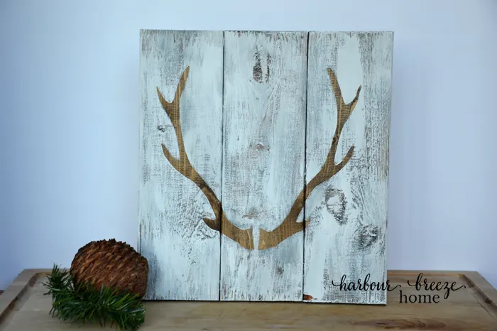 stenciled antlers wooden sign