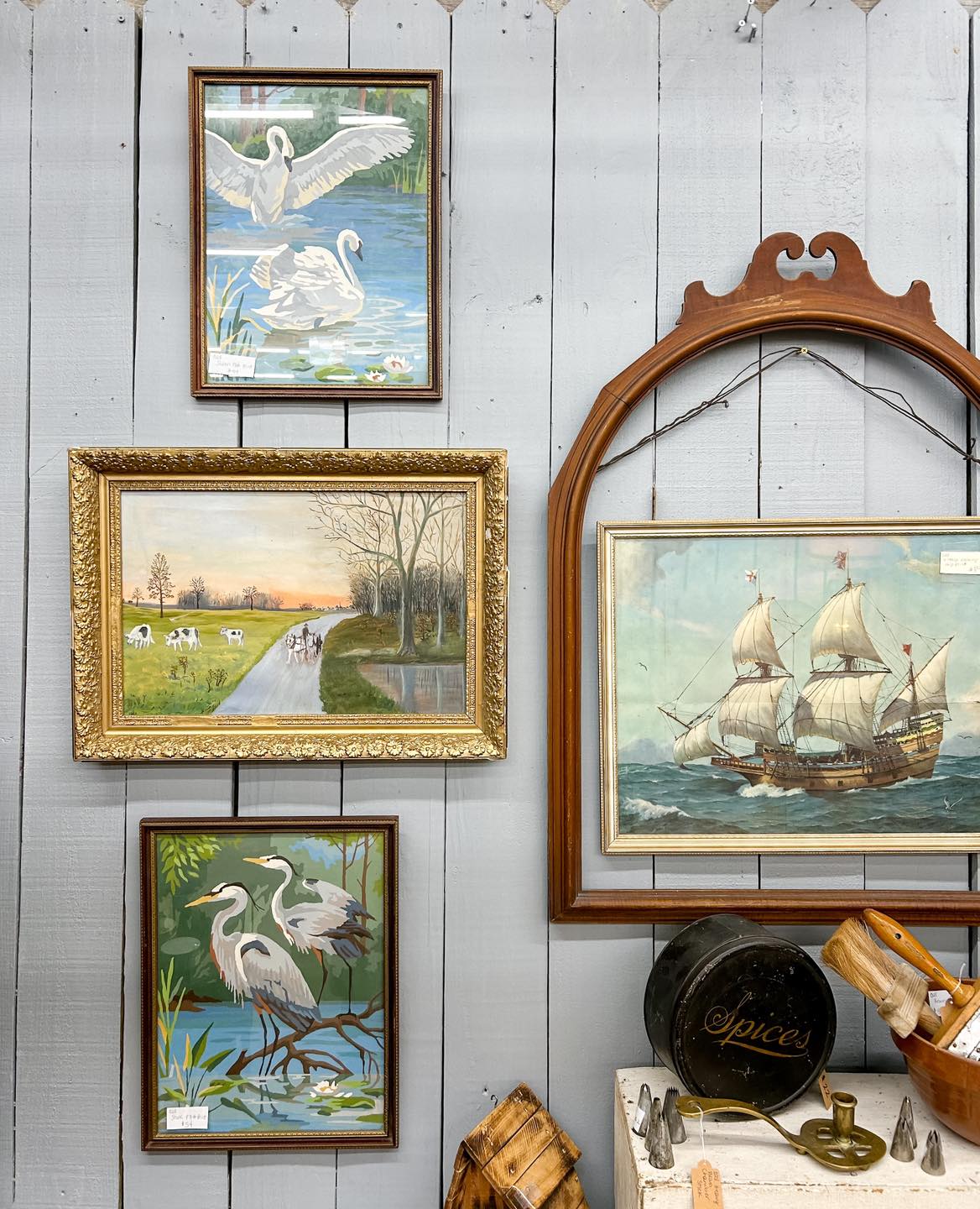 old paintings in an antique booth