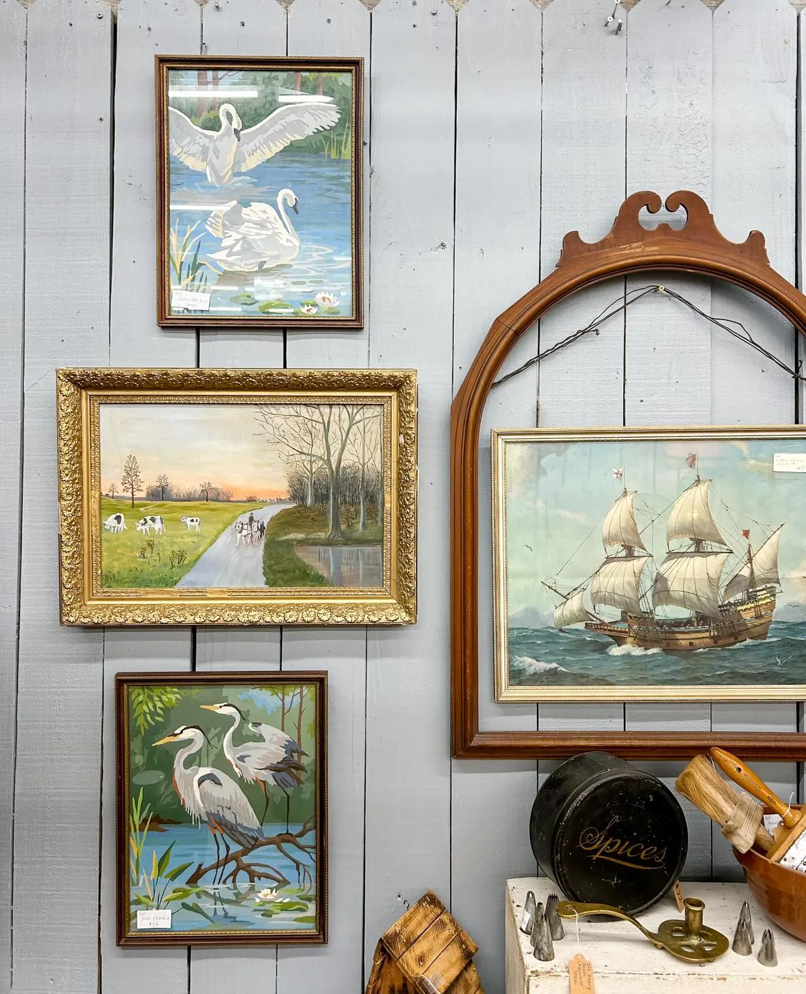 old paintings in an antique booth