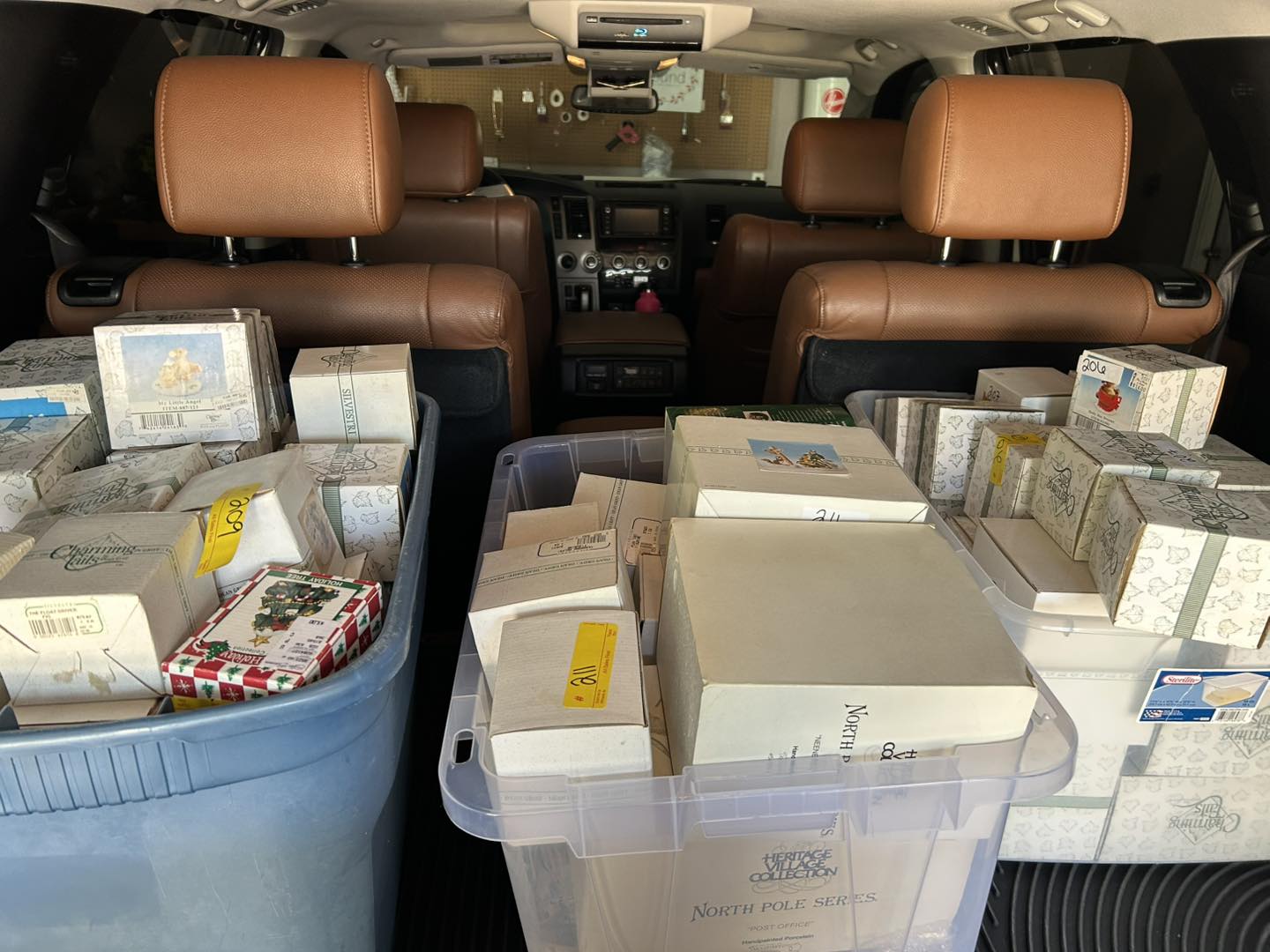 collectible figurines stacked in the back of a car