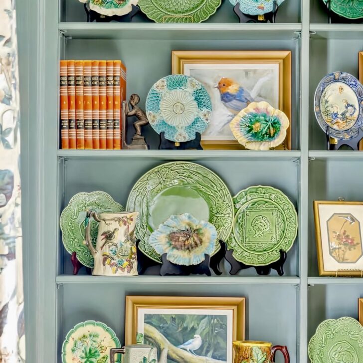 majolica displayed on a bookshelf