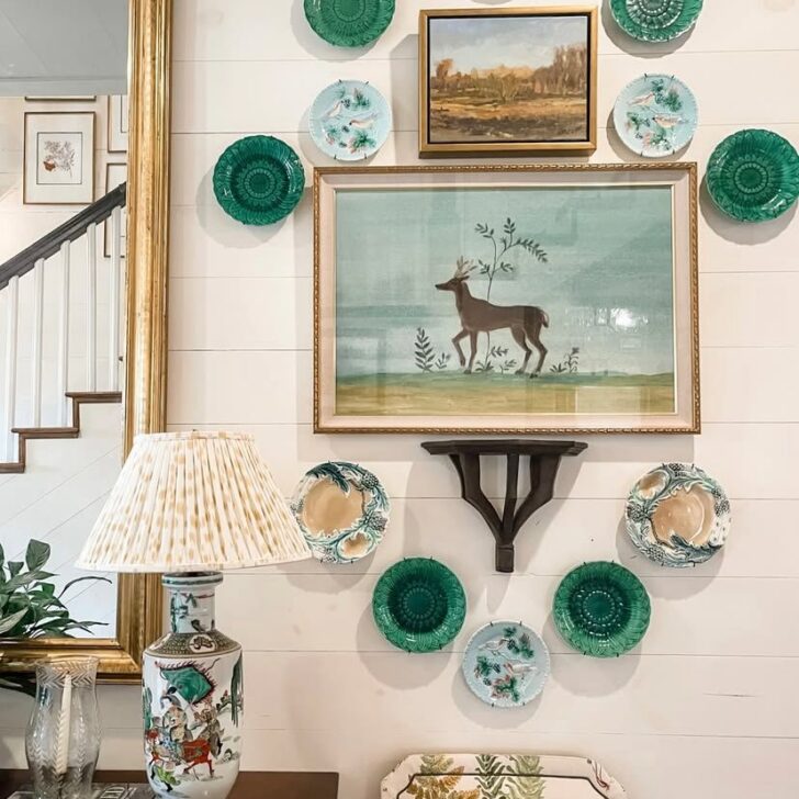 plates and art hung on a wall